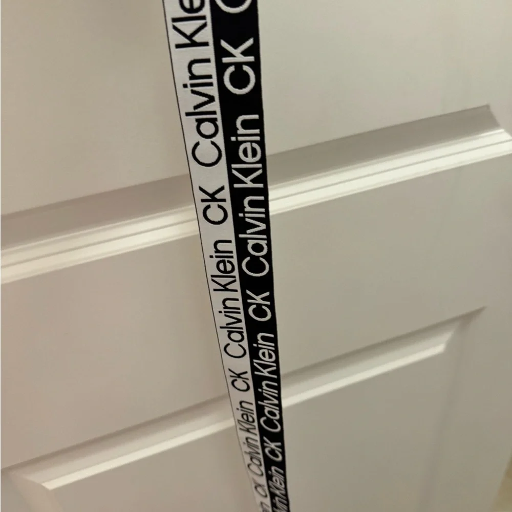 Calvin Klein, BELT bold black and white measured 63” long and very stretchy